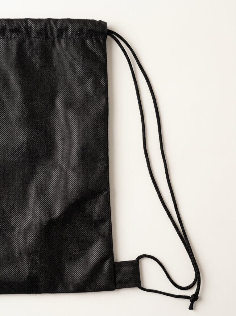 Mochila de tnt personalizada bi fechamento caracteristicas